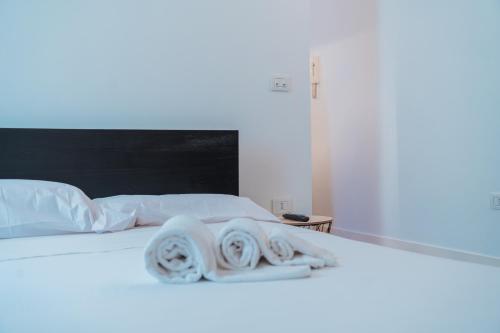 Ένα ή περισσότερα κρεβάτια σε δωμάτιο στο Don Rocco Historic Stay