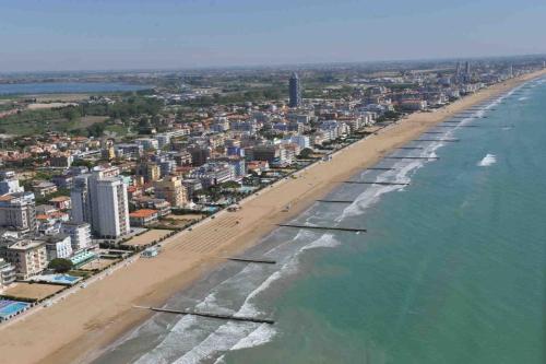 an aerial view of a beach with buildings and the ocean at Hotel Kristall in San Donà di Piave