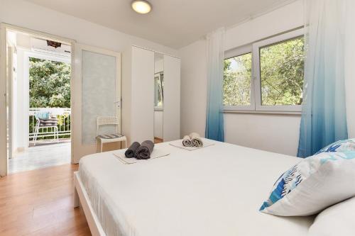 Posteľ alebo postele v izbe v ubytovaní Apartments Vlasta 1410