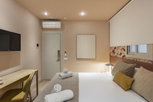 Posteľ alebo postele v izbe v ubytovaní Ola Living Hostal Diagonal