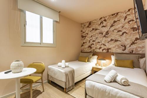 Posteľ alebo postele v izbe v ubytovaní Ola Living Hostal Diagonal