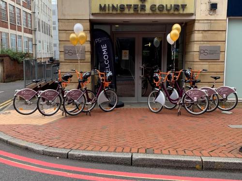 a group of bikes parked in front of a store at PREMIER SUITES Reading in Reading