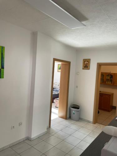a living room with a door open to a patio at Apartmán Marta in Banka