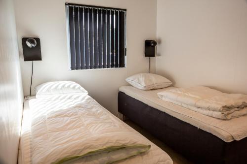 Postel nebo postele na pokoji v ubytování DCU-Camping Hornbæk