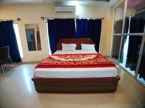 Ein Bett oder Betten in einem Zimmer der Unterkunft Hotel Sea Coast