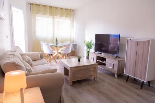 Et tv og/eller underholdning på Avenida Principal muy cerca de la playa - By Aloha Palma