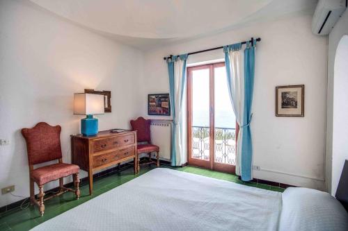 En eller flere senge i et værelse på Villa Circeo, con piscina e scesa al mare