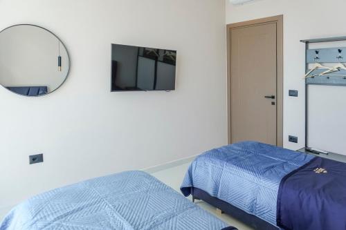 Ένα ή περισσότερα κρεβάτια σε δωμάτιο στο Mega Luxury Villa