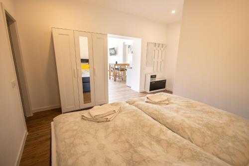 a bedroom with a large bed in a room at Havelpension in Rathenow