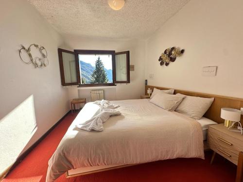 Postel nebo postele na pokoji v ubytování Comfort in the heart of Campligio