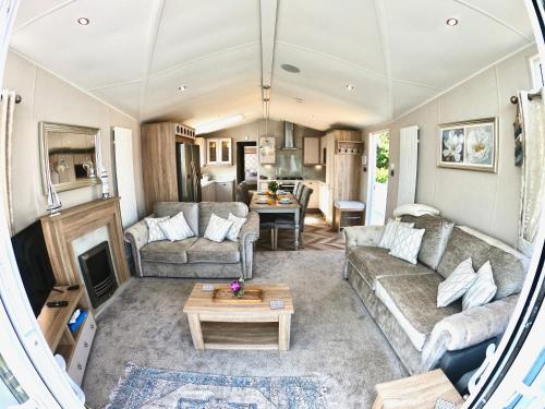a living room with a couch and a table at Lula Lodge in Scarborough