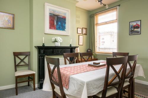 a dining room with a table and chairs at Central 2 BR Cosy House in Rugby