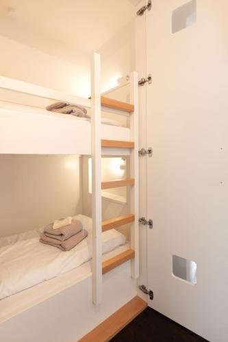 a room with bunk beds and a closet at Wohnung Solt in Juist