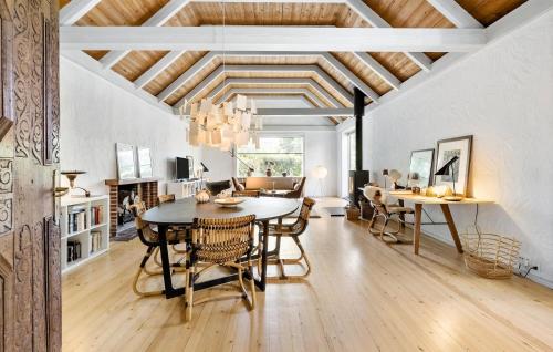 a dining room with a table and chairs at Beautiful Home In Odense M With Wifi in Odense