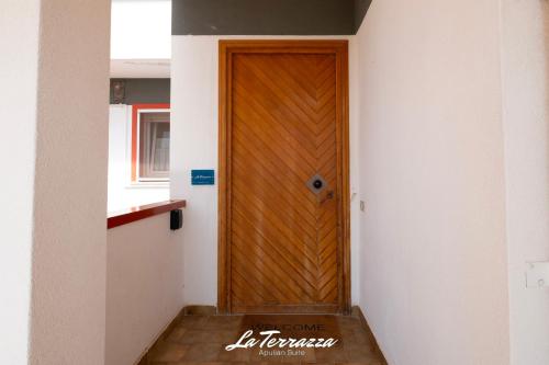 a wooden door in a room with a wooden floor at La Terrazza in Noicattaro