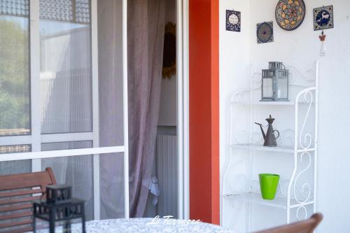 a room with a table and a window at La Terrazza in Noicattaro