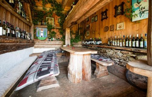 a bar with a table and bottles of wine at Kellerstöckl Deutschlandsberg in Deutschlandsberg