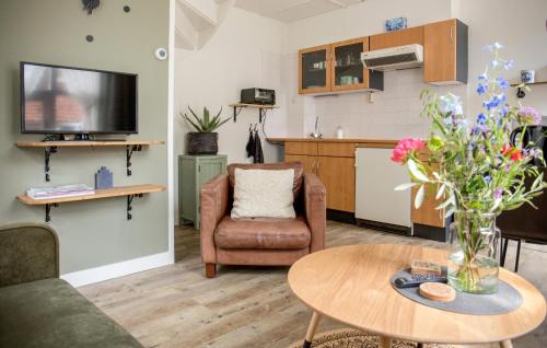 a living room with a couch and a table at Nice Home In Blokzijl With Wifi in Blokzijl