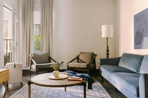 a living room with a couch and a table and chairs at Sonder by Marriott Bonvoy Village 21 Apartments Hillsboro Village in Nashville