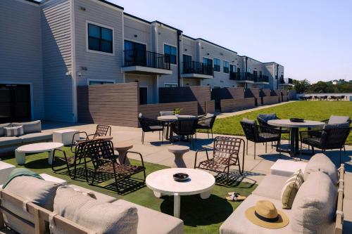 a patio with tables and chairs and tables and chairs at Sonder by Marriott Bonvoy Belcourt Apartments Hillsboro Village in Nashville
