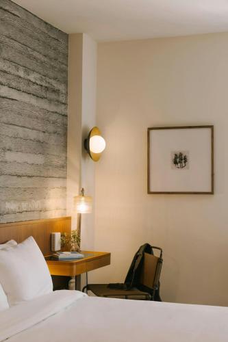 a hotel room with a bed and a desk at Henri on 24 Hotel Chelsea, Sonder by Marriott Bonvoy in New York