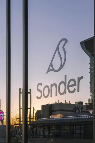 a sign for a s wonder in front of a building at Sonder by Marriott Bonvoy North Loop Green Apartments North Loop in Minneapolis
