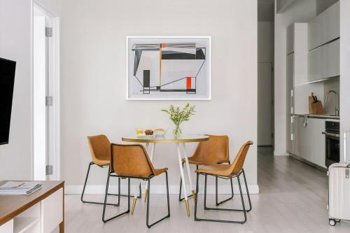 a dining room with a table and chairs at Sonder by Marriott Bonvoy Battery Park Apartments Financial District in New York