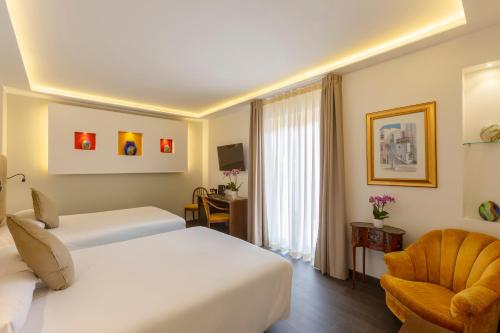 Hotel Central Wellnessにあるベッド