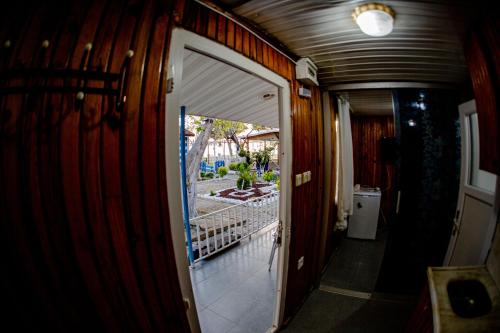 a hallway with a door leading to a balcony at Devrim Apart in Ocaklar