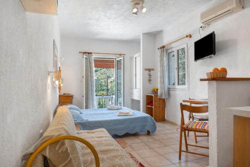 Ένα ή περισσότερα κρεβάτια σε δωμάτιο στο Elite Apartments Kalymnos
