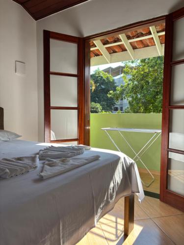 Postel nebo postele na pokoji v ubytování Pousada Recanto Itaguá