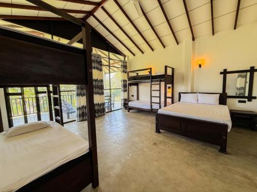 Ein Bett oder Betten in einem Zimmer der Unterkunft Go Yala Hostel