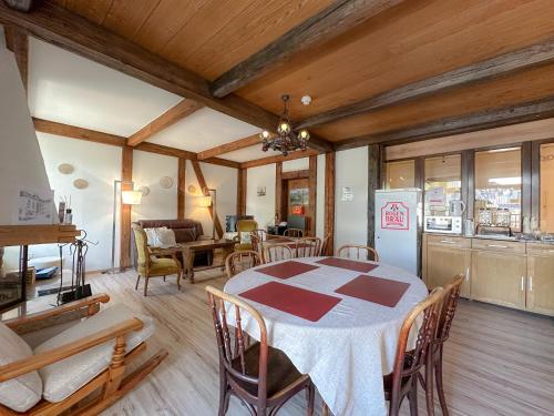 a kitchen and dining room with a table and chairs at Hotel Harder Minerva in Interlaken