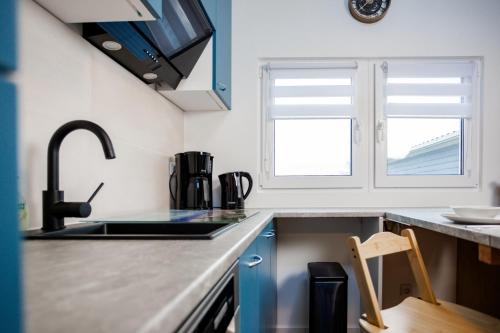 Kuchyň nebo kuchyňský kout v ubytování Tiny Haus Boddenblick