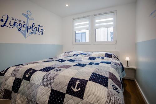 Postel nebo postele na pokoji v ubytování Tiny Haus Boddenblick