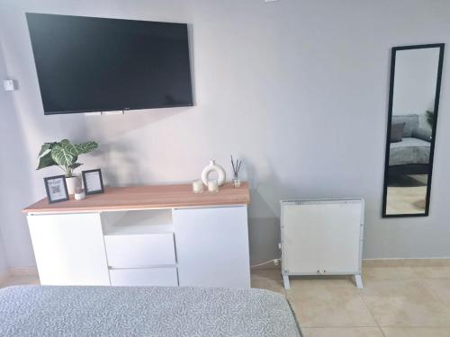 TV a/nebo společenská místnost v ubytování Calido e impecable departamento en el centro de la ciudad