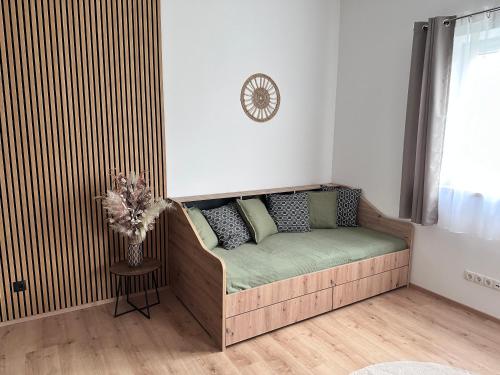 a couch in the corner of a living room at Ferienwohnung Schneeflock in Birkfeld