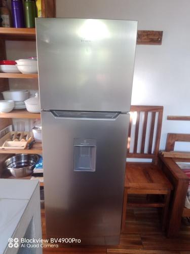 a stainless steel refrigerator in a kitchen at My Little House in Mandriankeniheny