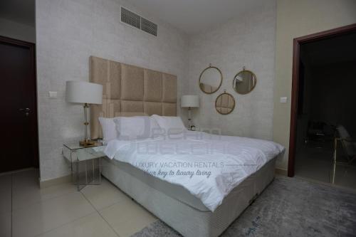 Ένα ή περισσότερα κρεβάτια σε δωμάτιο στο Downtown 29 Boulevard Tower