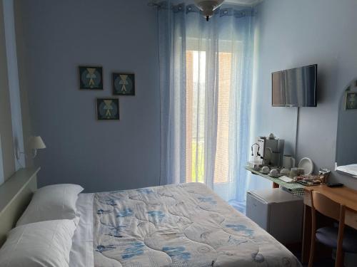 Postel nebo postele na pokoji v ubytování Hotel Meri 1956 Locanda e Cucina