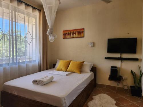 Postel nebo postele na pokoji v ubytování Stay with Adhiambo - Studio near Bofa Beach