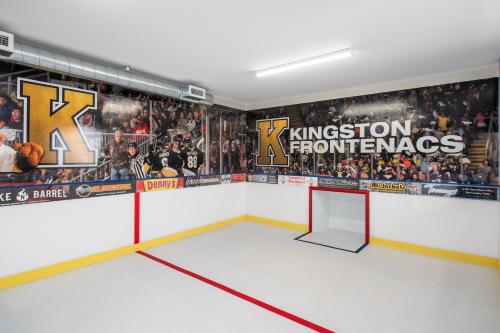 a room with a hockey team mural on the wall at Comfort Suites Kingston Central in Kingston