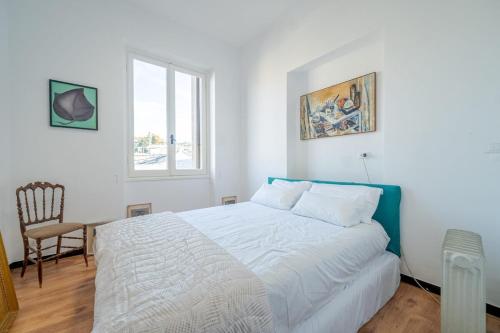 Una cama o camas en una habitación de Garibaldino al palazzo dei rolli nel cuore della città