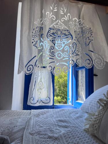 Кровать или кровати в номере Emporios Traditional Sea View House