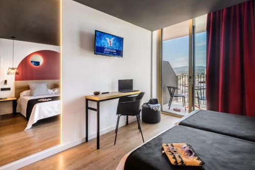 Ένα ή περισσότερα κρεβάτια σε δωμάτιο στο Hotel Vibra District - Adults Only