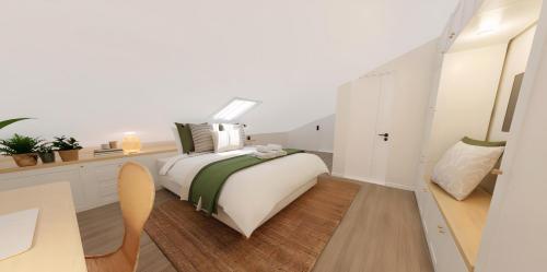 a white bedroom with a bed and a desk at Sítio 4 in Nazaré