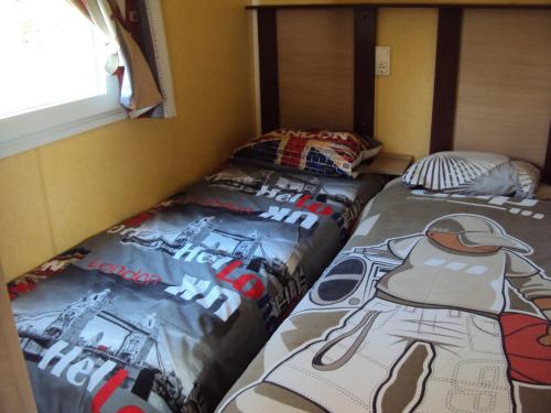 En eller flere senge i et værelse på B&B La Douloire
