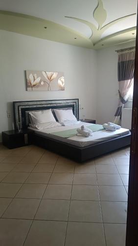 a bedroom with a large bed in a room at Lyra's house in Skiathos Town
