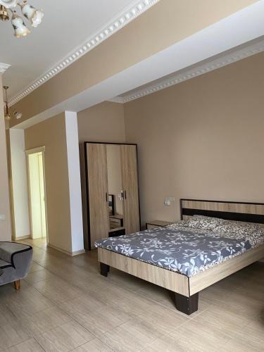 a bedroom with a large bed in a room at Hotel Elita in Odesa