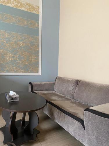a living room with a couch and a table at Hotel Elita in Odesa